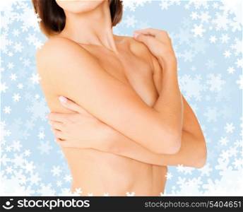 health, medicine, beauty concept - topless woman with perfect skin and hands over breast