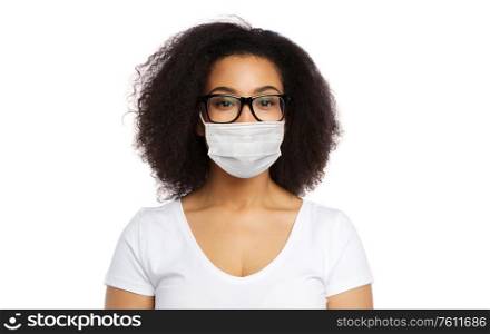 health, pandemic and safety concept - african american young woman wearing face protective medical mask for protection from virus disease over white. african american woman in protective medical mask