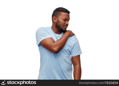 health problem and people concept - unhealthy african american man suffering from shoulder pain over white background. african american man suffering from shoulder pain