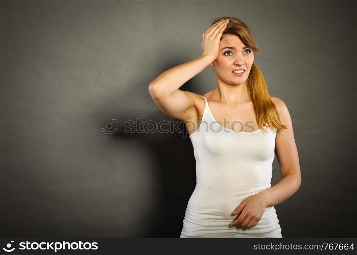 Health problem, stress and depression. Woman suffering from headache migraine pain. Stressed female holds her head with hands. Woman suffering from headache migraine pain.