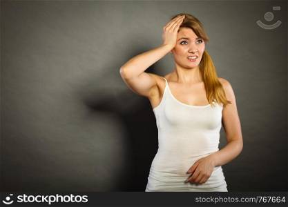 Health problem, stress and depression. Woman suffering from headache migraine pain. Stressed female holds her head with hands. Woman suffering from headache migraine pain.