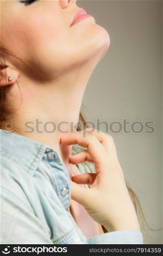 Health problem. Young woman scratching her itchy nack with allergy rash