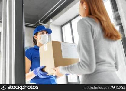 health protection, safety and pandemic concept - delivery woman in face protective mask and gloves giving parcel box to female customer at office. delivery girl in face mask giving parcel to woman