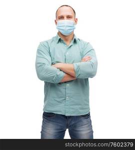 health, quarantine and pandemic concept - young man wearing protective medical mask for protection from virus disease over grey background. young man in protective medical mask