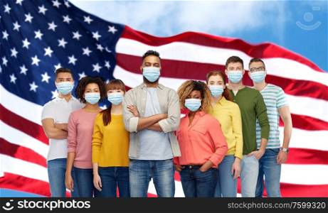 health, safety and pandemic concept - group of people wearing protective medical masks for protection from virus over american flag background. people in medical masks for protection from virus