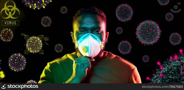 health, safety and pandemic concept - young african american man wearing protective mask or respirator over coronavirus virions on black background. african man in respirator protecting from virus