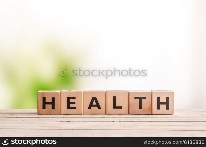 Health sign made of wood on a natural desk