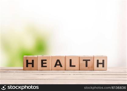 Health sign made of wood on a natural desk