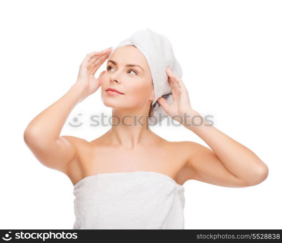 health, spa and beauty concept - beautiful woman in towel