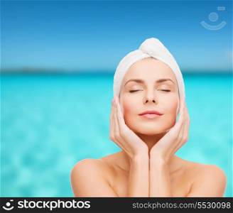 health, spa and beauty concept - beautiful woman in towel