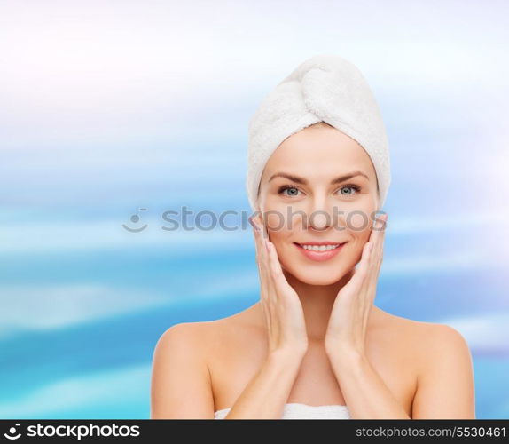 health, spa and beauty concept - beautiful woman in towel