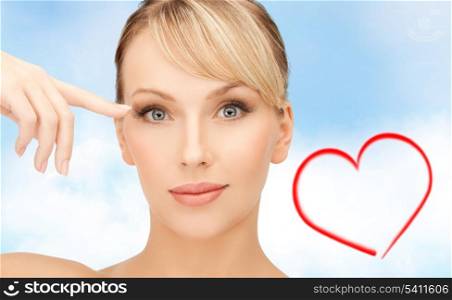 health, spa and beauty concept - beautiful woman touching her eye area