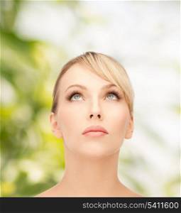 health, spa and beauty concept - beautiful woman with blonde hair looking up