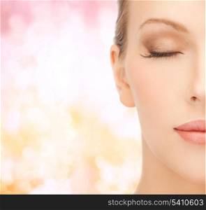 health, spa and beauty concept - close up of face of beautiful young woman