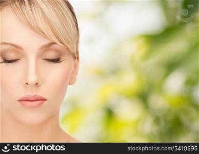health, spa and beauty concept - face of beautiful woman with blonde hair