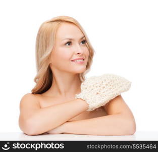 health, spa and beauty concept - smiling woman with exfoliation glove