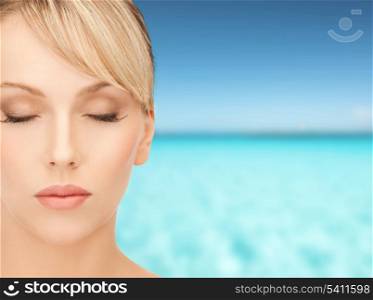 health, spa, beauty and vacation concept - face of beautiful woman with blonde hair