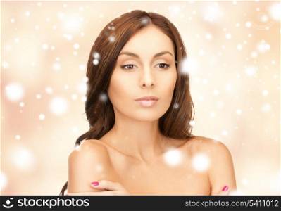 health, spa, beauty concept - face, hands and shoulders of beautiful woman