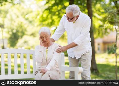 health, stress, old age and people concept - senior woman suffering from headache outdoors. senior woman suffering from headache outdoors