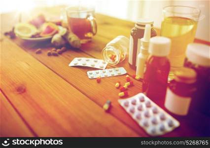health, traditional medicine and ethnoscience concept - natural and synthetic drugs on wooden table. traditional medicine and synthetic drugs