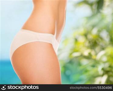 health, vacation, summer holidays and beauty concept - woman in cotton underwear