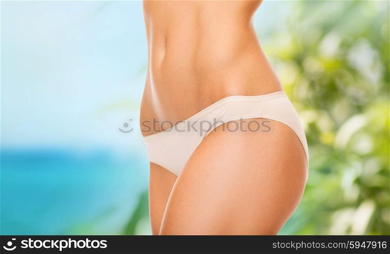 health, vacation, summer holidays and beauty concept - woman in cotton underwear