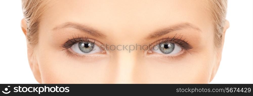 health, vision and beauty concept - closeup of face of beautiful young woman