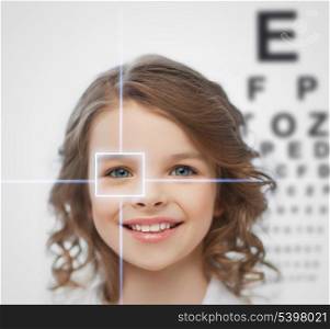 health, vision, medicine, laser correction, happy people concept - smiling pre-teen girl with optometric table or eyesight testing board