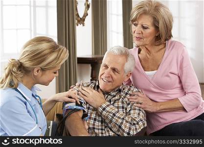 Health Visitor Taking Senior Man&acute;s Blood Pressure