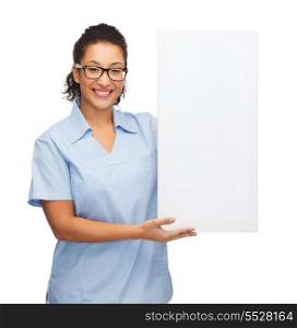 healthcare, advertisement and medicine concept - smiling female african american doctor or nurse in eyeglasses with small white blank board