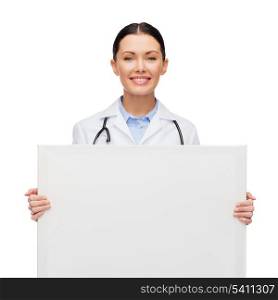healthcare, advertisement and medicine concept - smiling female doctor with stethoscope with white blank board