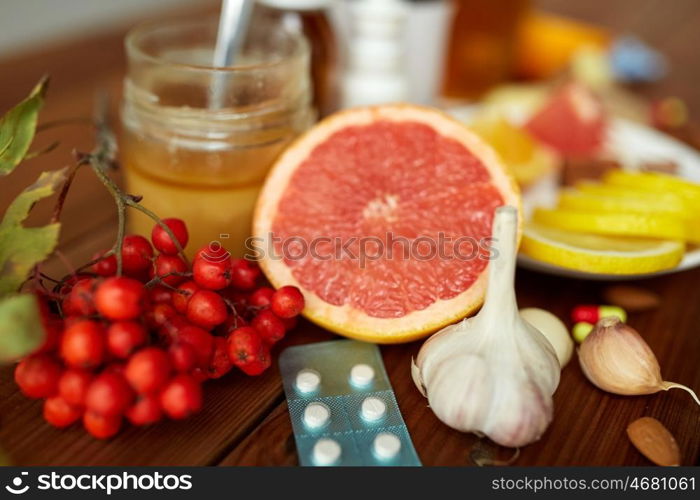 healthcare and ethnoscience concept - traditional medicine and drug pills on wooden table. traditional medicine and drugs