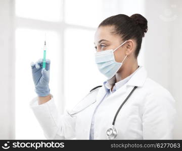 healthcare and medical concept - african doctor holding syringe with injection