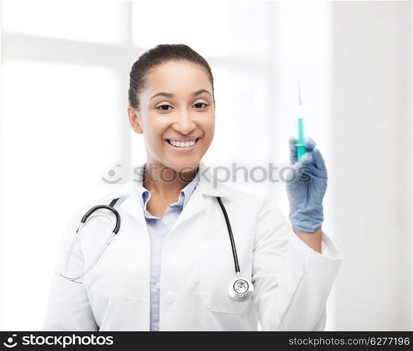 healthcare and medical concept - african doctor holding syringe with injection