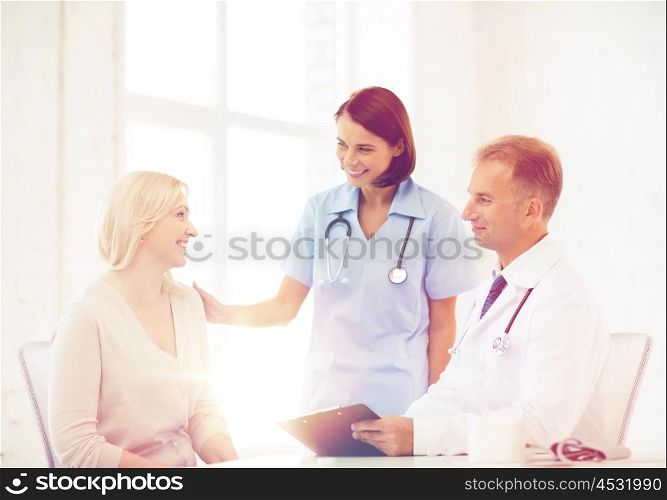 healthcare and medical concept - doctor and nurse with patient in hospital. doctor with patient in hospital