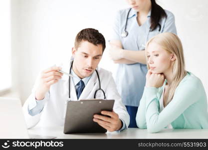 healthcare and medical concept - doctor and nurse with patient in hospital