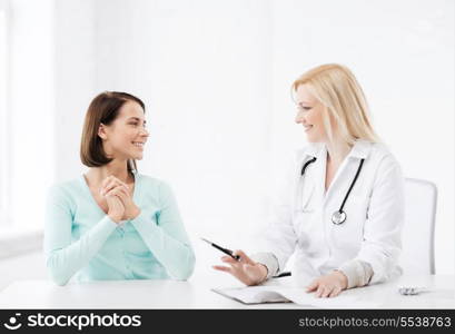 healthcare and medical concept - doctor with patient in hospital