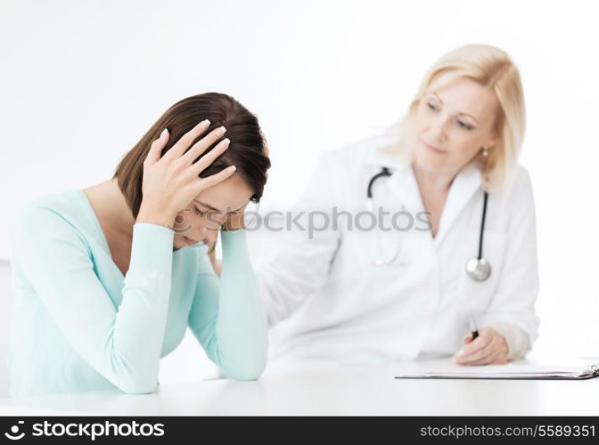 healthcare and medical concept - doctor with patient in hospital