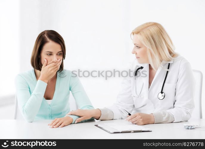 healthcare and medical concept - doctor with patient in hospital