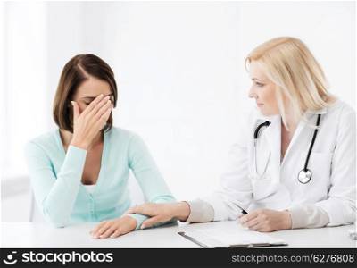 healthcare and medical concept - doctor with patient in hospital