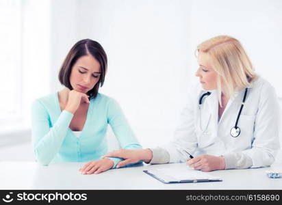 healthcare and medical concept - doctor with patient in hospital. doctor with patient in hospital