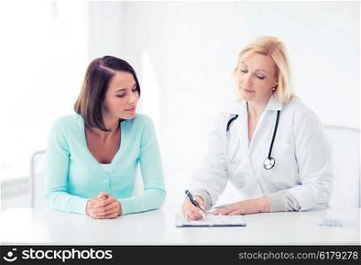 healthcare and medical concept - doctor with patient in hospital. doctor with patient in hospital