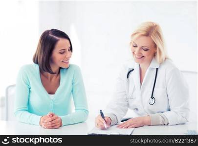 healthcare and medical concept - doctor with patient in hospital. doctor with patient in hospital