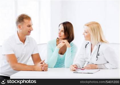 healthcare and medical concept - doctor with patients in cabinet