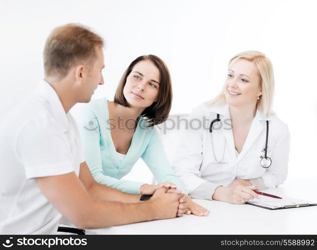 healthcare and medical concept - doctor with patients in cabinet