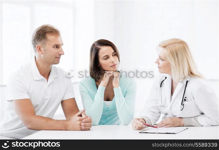 healthcare and medical concept - doctor with patients in cabinet