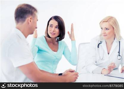 healthcare and medical concept - doctor with patients in cabinet. doctor with patients in cabinet