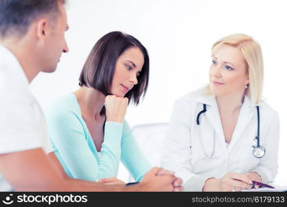 healthcare and medical concept - doctor with patients in cabinet. doctor with patients in cabinet