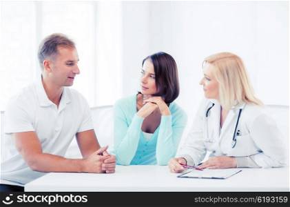 healthcare and medical concept - doctor with patients in cabinet. doctor with patients in cabinet
