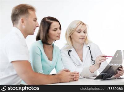 healthcare and medical concept - doctor with patients looking at x-ray